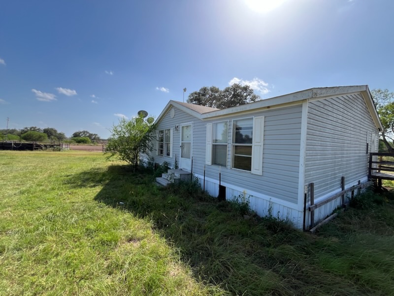 3 Bed / 2 Bath Double-Wide Handyman Special in Yorktown TX — exterior front